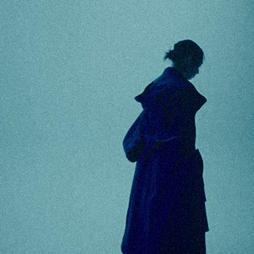 Thumbnail image for keshi's song 'Angostura'. Depicts a shadowy cloaked figure.