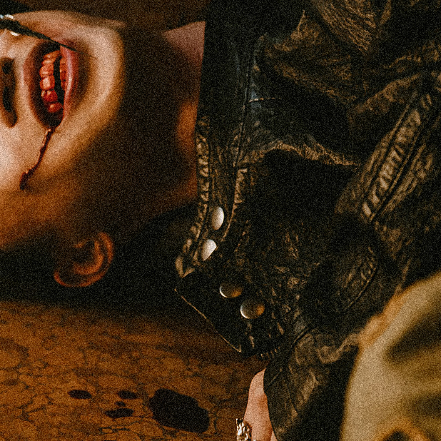 Thumbnail image for keshi's song 'GET IT'. Depicts someone on the floor grinning while blood is in their mouth.