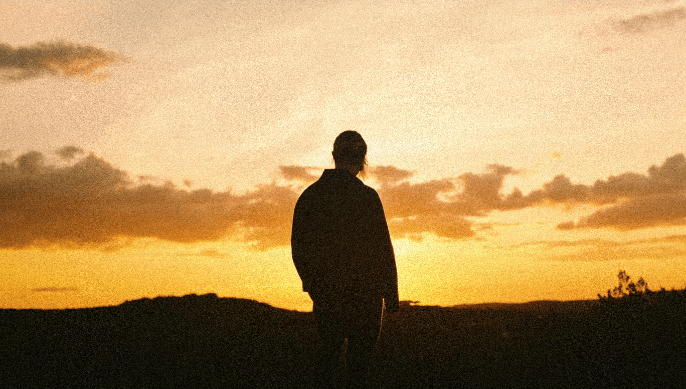 Cover for the Always extended play showing a man looking at a sunset.