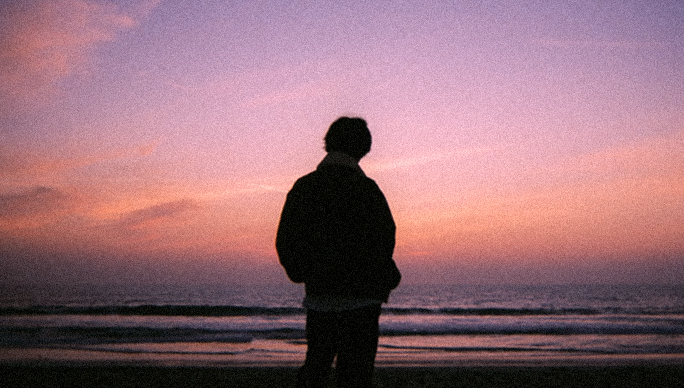 Cover for the Bandaids extended play showing a man looking out at the beach.