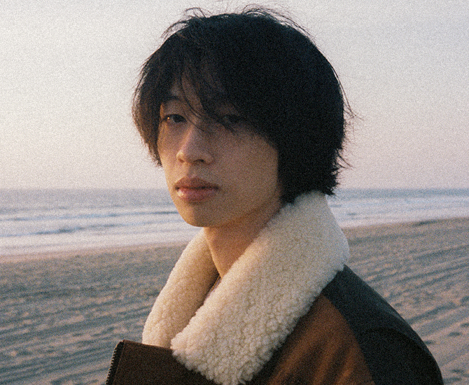 A headshot of keshi at the beach.