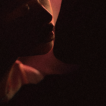 Thumbnail image for keshi's song 'SOMEBODY'. Depicts two people about to kiss in the dark.